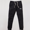 A black fleece sweatpant features "TMU" on the left hip, printed in white.