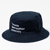 A unstructured navy bucket hat that features the Stacked Wordmark Logo, in white