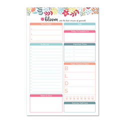 A Bloom brand six inch by nine inch planning pad with botanical details.