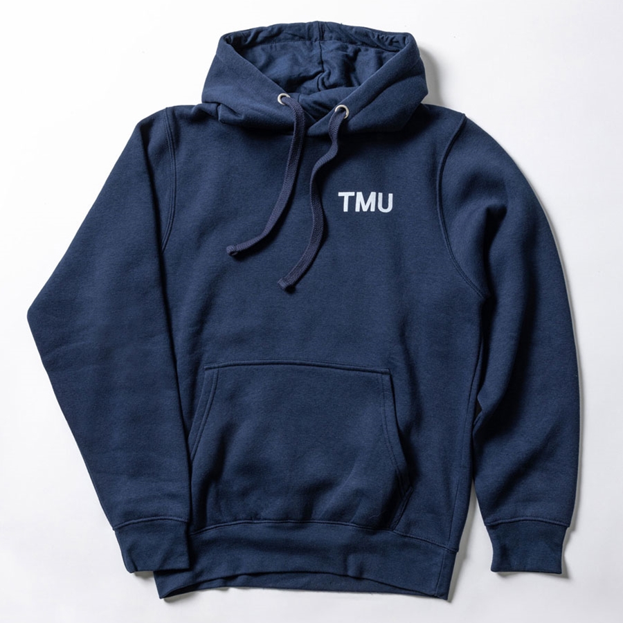 Navy pullover fleece hoodie is printed on both sides: a small "TMU" logo on the front left chest, and a large white corporate "Toronto Metropolitan University" logo on the back.