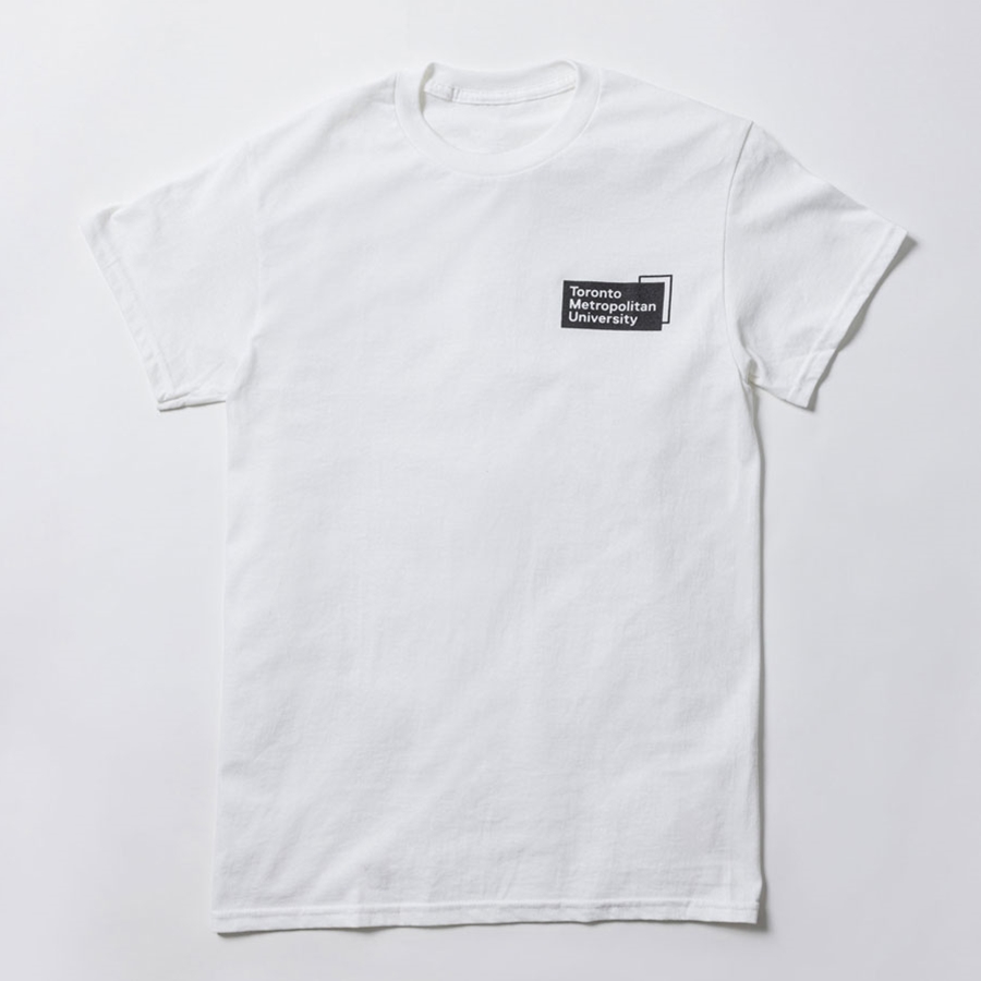 A short-sleeved white t-shirt features a printed "Toronto Metropolitan University" corporate logo on the front left chest in black.